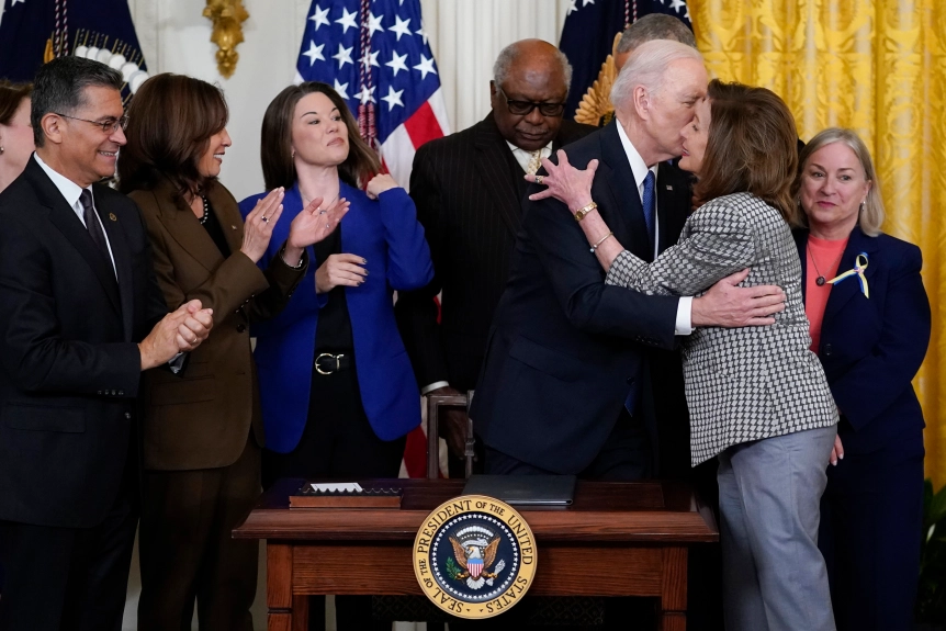 This image has an empty alt attribute; its file name is pelosi-kissing-Biden.webp